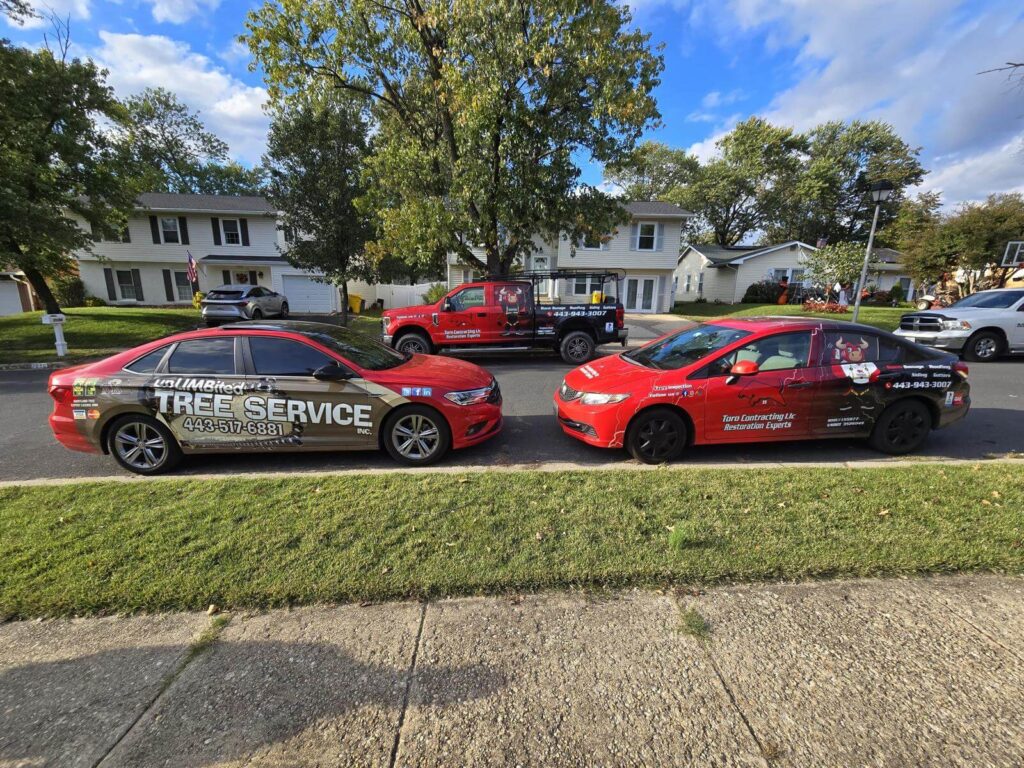 Toro Contracting LLC vehicles for roof restoration, siding repair, and gutter services in Maryland neighborhood