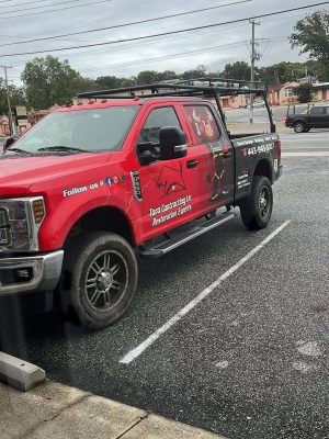 Toro Contracting truck providing roof restoration and storm damage repair services in Maryland.