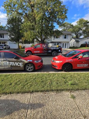 Toro Contracting LLC vehicles for roof restoration, siding repair, and gutter services in Maryland neighborhood